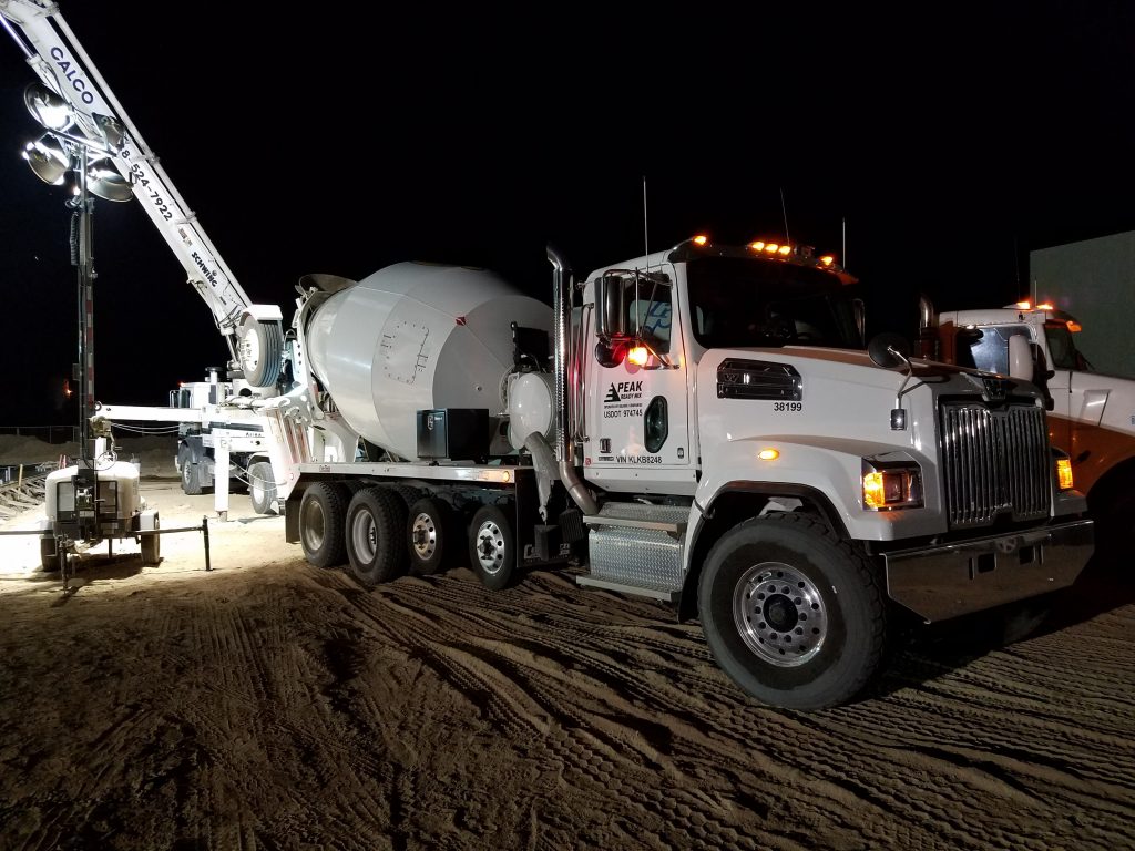 Cement truck at concrete foundation pouring