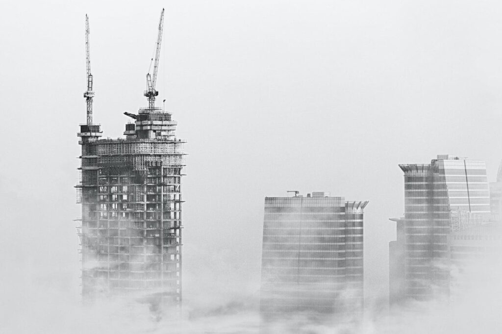 photo of skyscrapers surrounded with clouds
